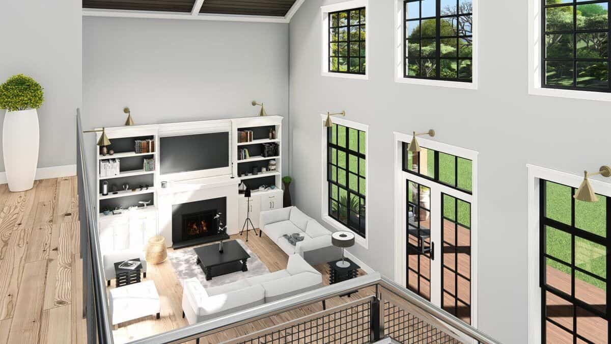 A view of the bright living room from the second-level balcony.