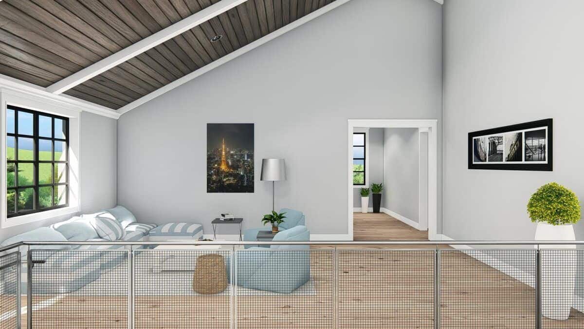 Steel railings frame the vaulted loft.