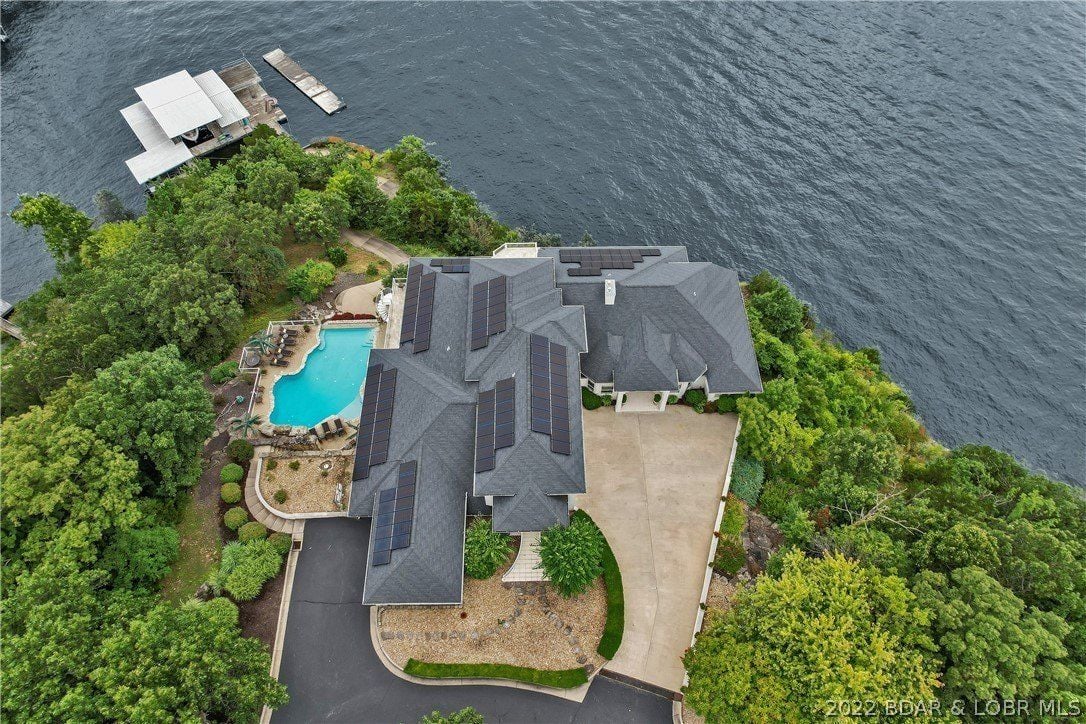 The aerial view of the house and the lake.