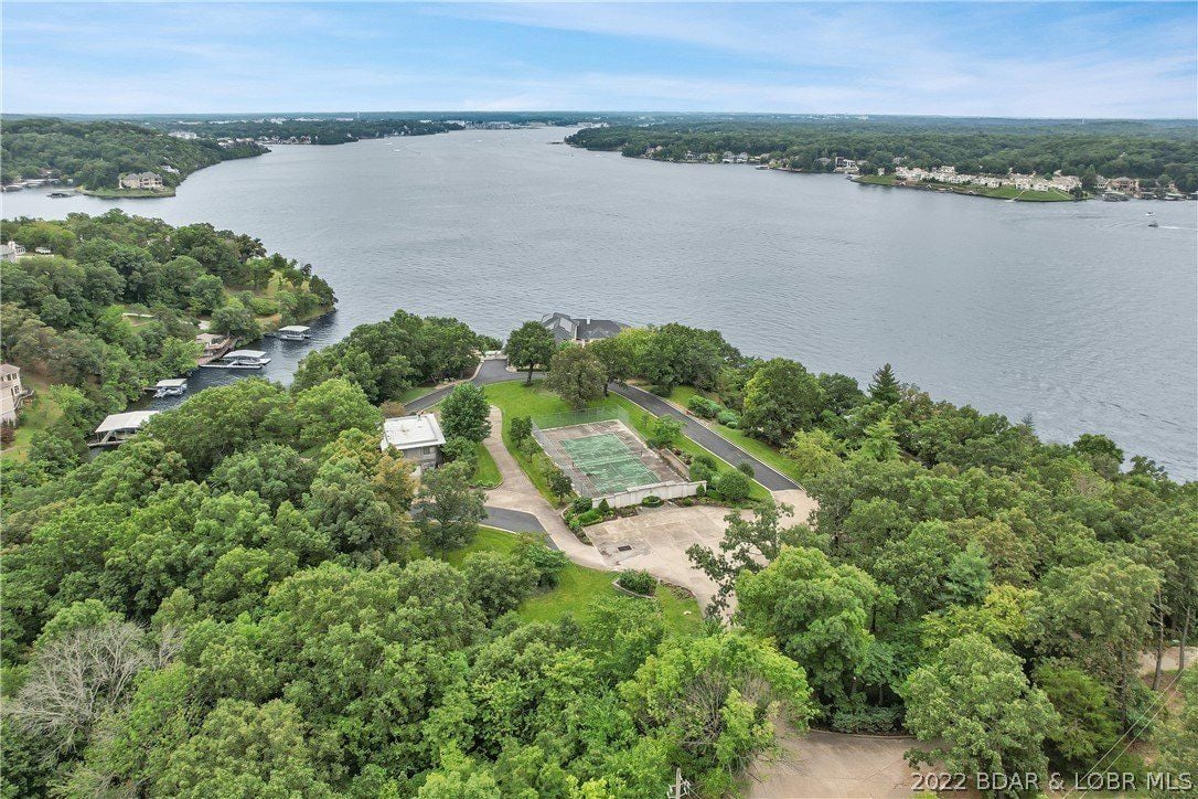 The aerial view of the tennis table and the lake.