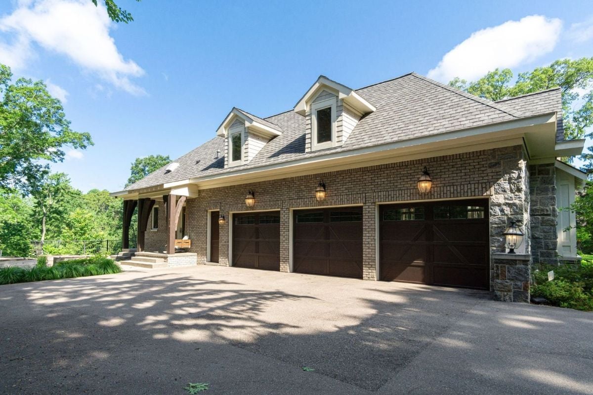 The house features an attached garage with brick walls and concrete flooring.