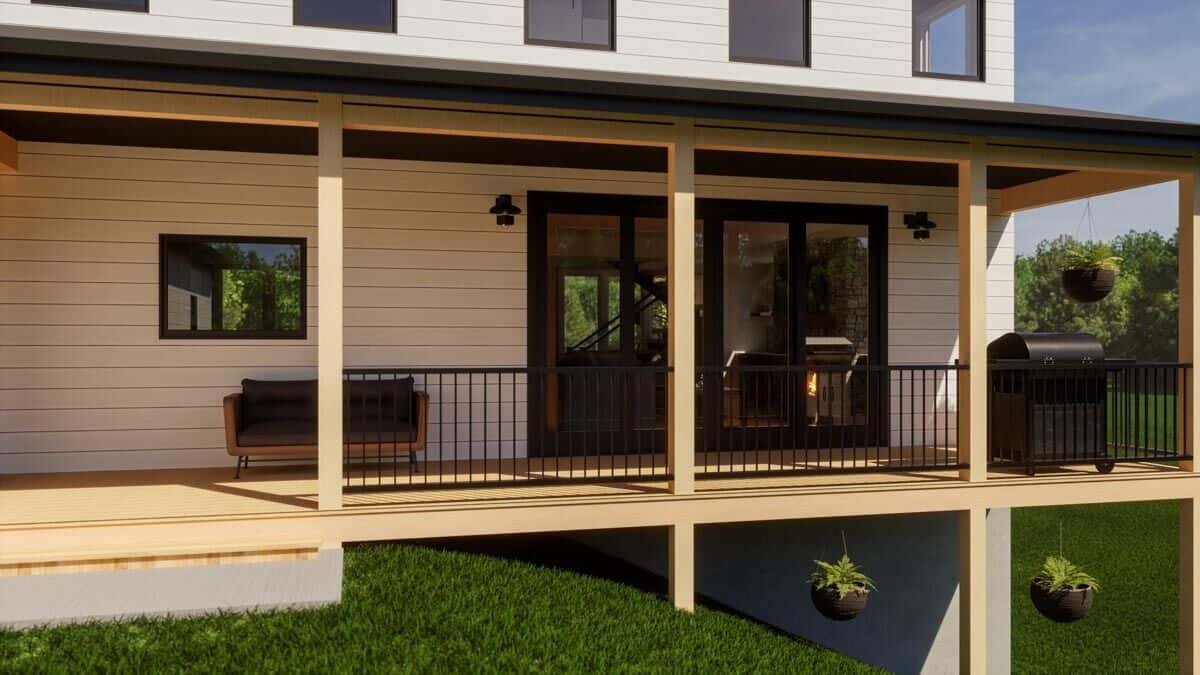 The covered deck has a cushioned sofa and a barbecue grill perfect for entertaining.