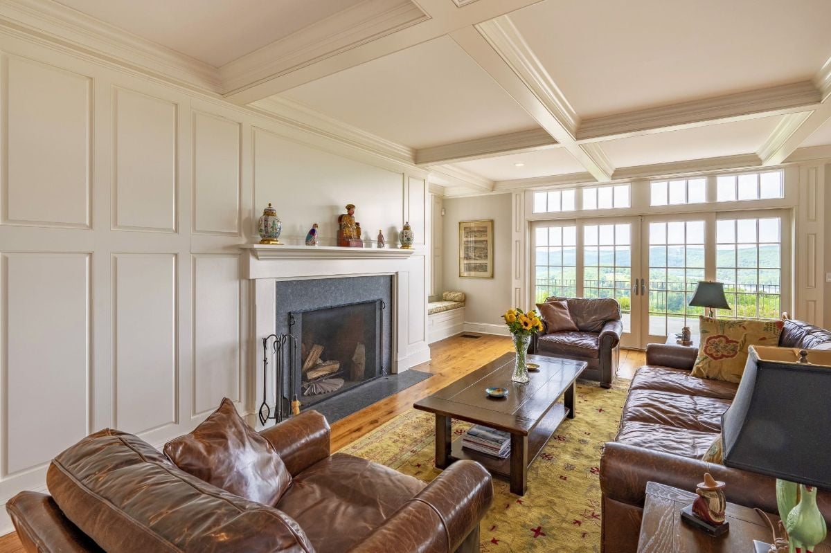 The cozy living room boasted a luxurious leather sofa positioned perfectly in front of the crackling fireplace, creating the ideal setting for a chilly evening spent in comfort.