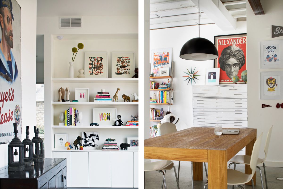 The dining room has open storage that contains books and figurines, the place is decorated with artwork.