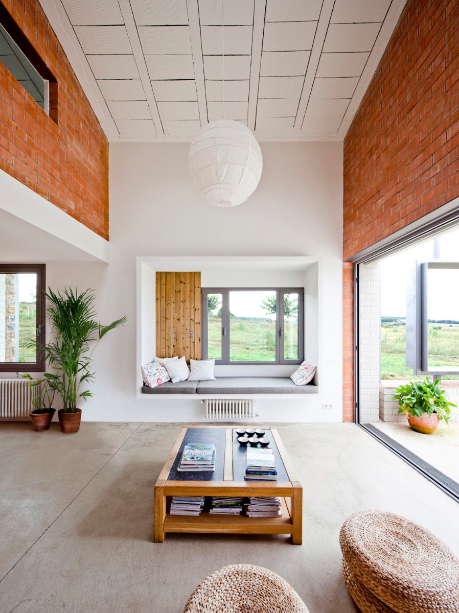A living room with double height near the main entrance.