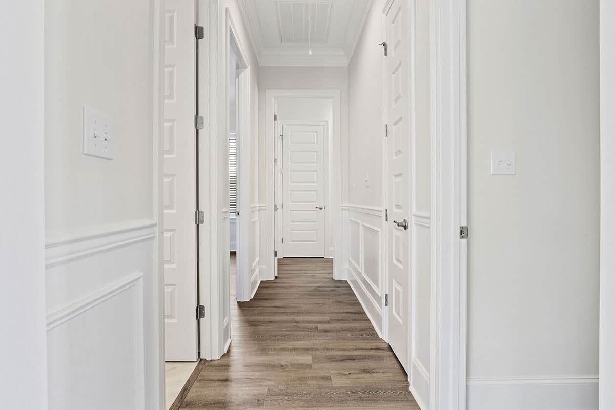 A hallway leading to the secondary bedrooms and laundry room.