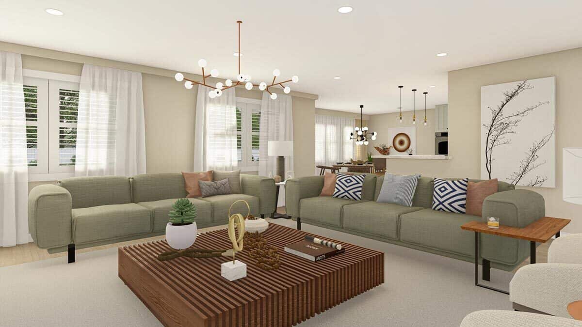 A gray area rug defines the living room in the open floor plan.