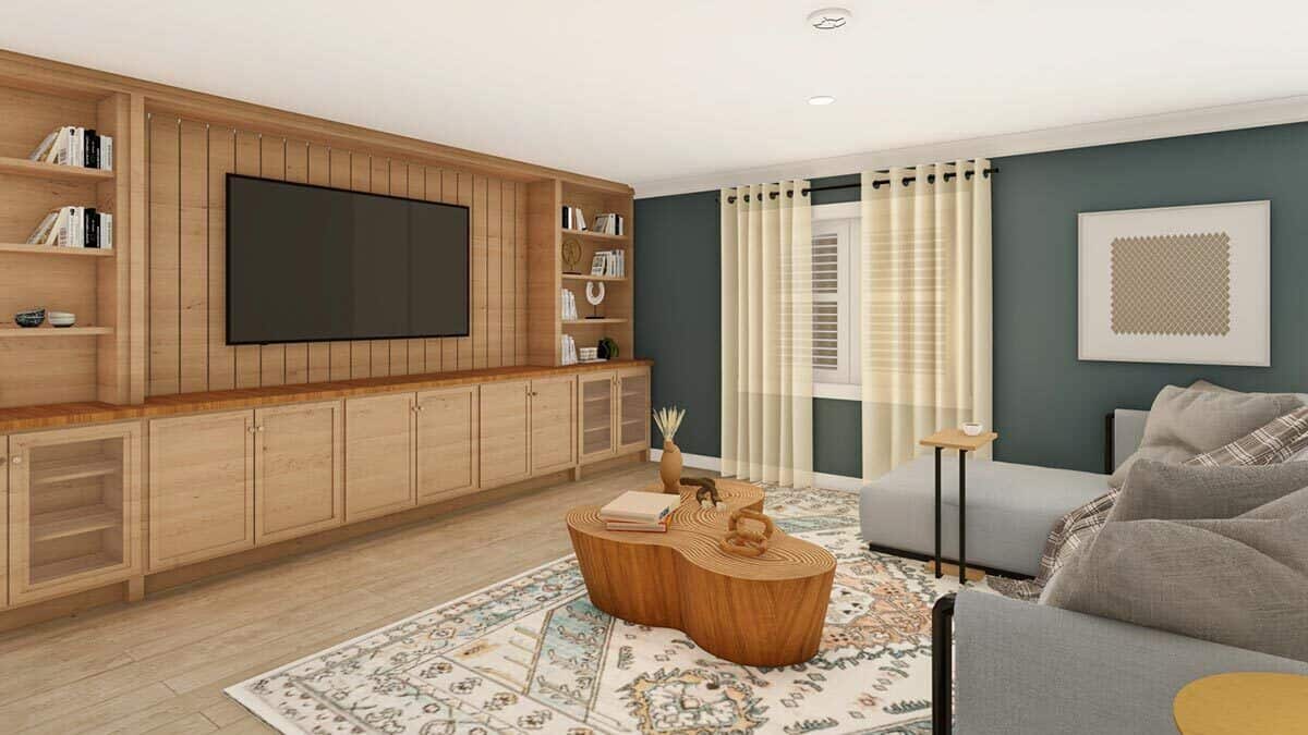 The lower-level family room offers a TV and an L-shaped sofa paired with a stump coffee table.