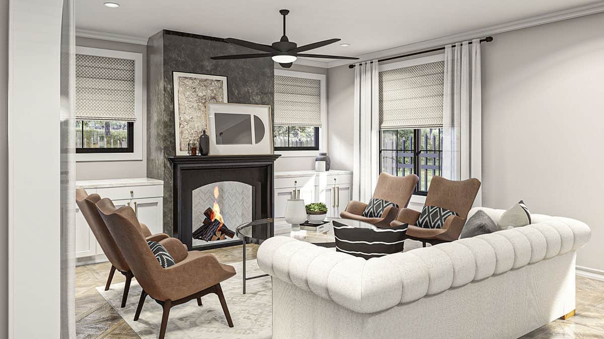 The great room features modern seats and a fireplace flanked by base cabinets.