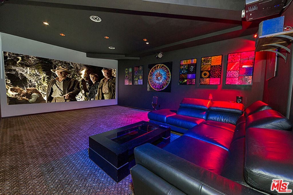 The cozy in-home theater featured plush leather sofas and a giant screen, making it the perfect place to watch movies with family and friends.