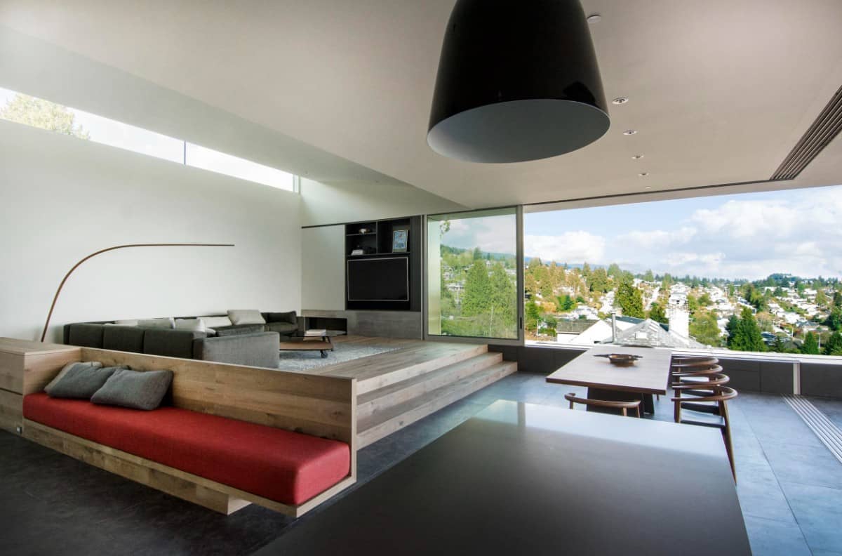 A panoramic window provides the open living space with expansive views and an abundant amount of natural sunlight.