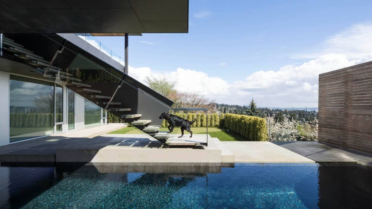 The pool terrace includes an exterior staircase for a seamless connection on the upper balcony.