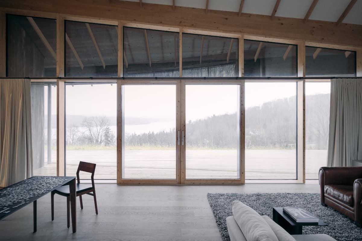 Other side of the living room with outdoor access and a view of Lake Massawippi.