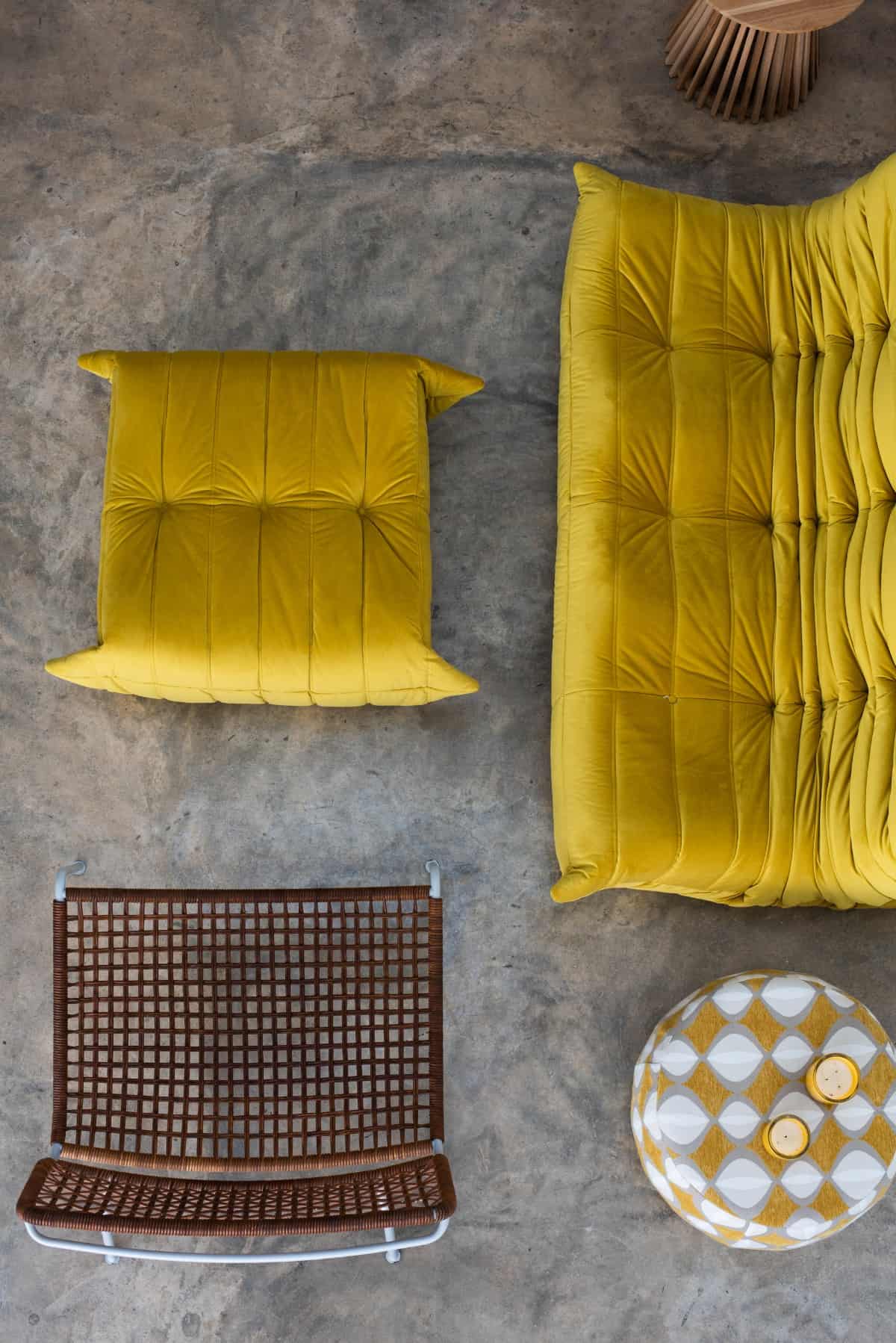 Bright yellow seats add a pop of color to the living room.