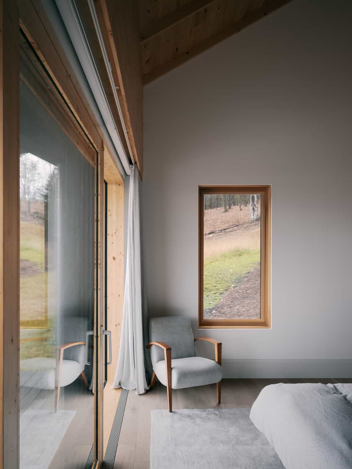 A small armchair in the corner provides a comfy sitting area.