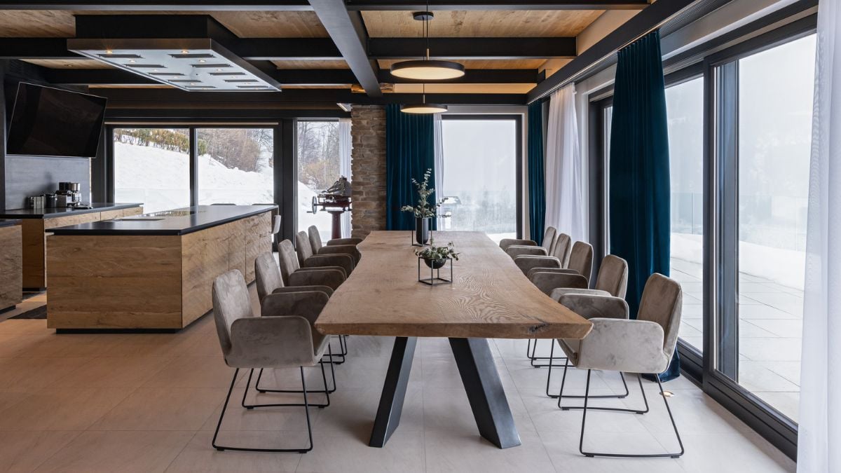 The dining table features suitable seating for a large number of people.