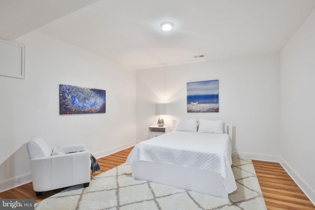 The comfortable bed was made even more inviting by the soft and cozy area rug placed beneath it.