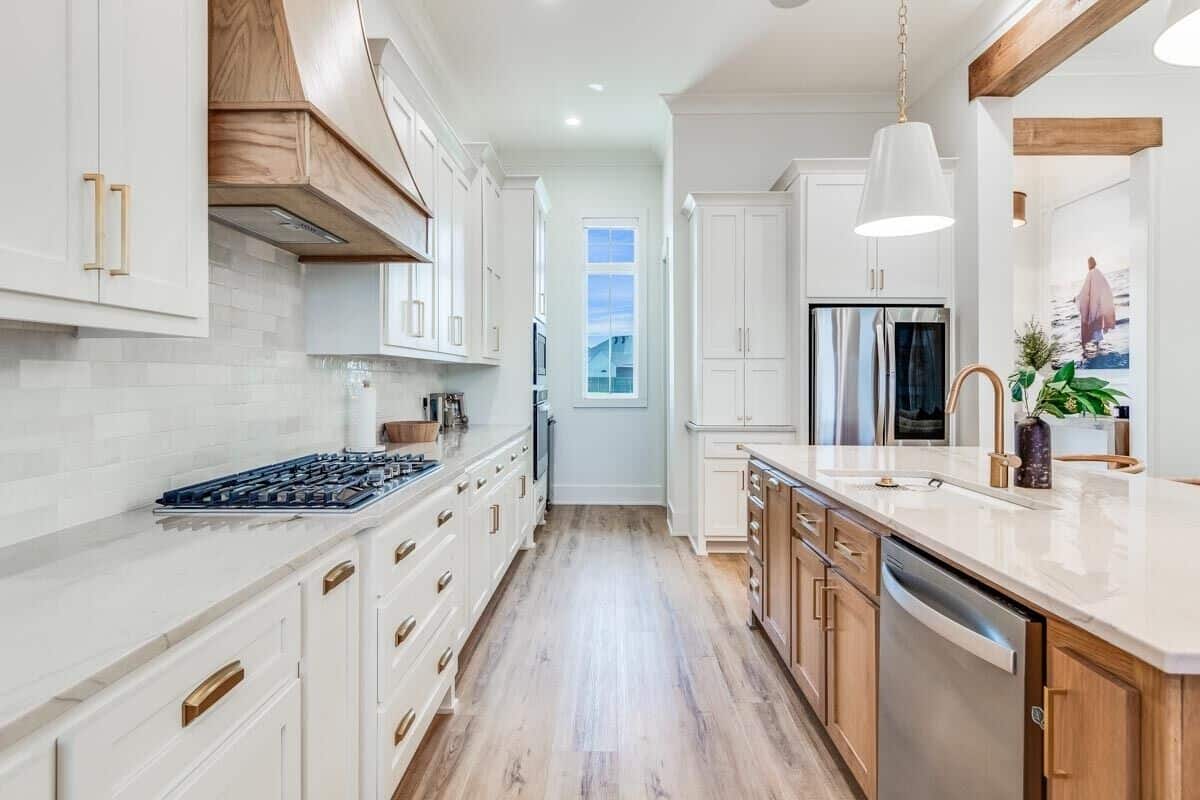 Premium appliances and a walk-in pantry complete the kitchen.