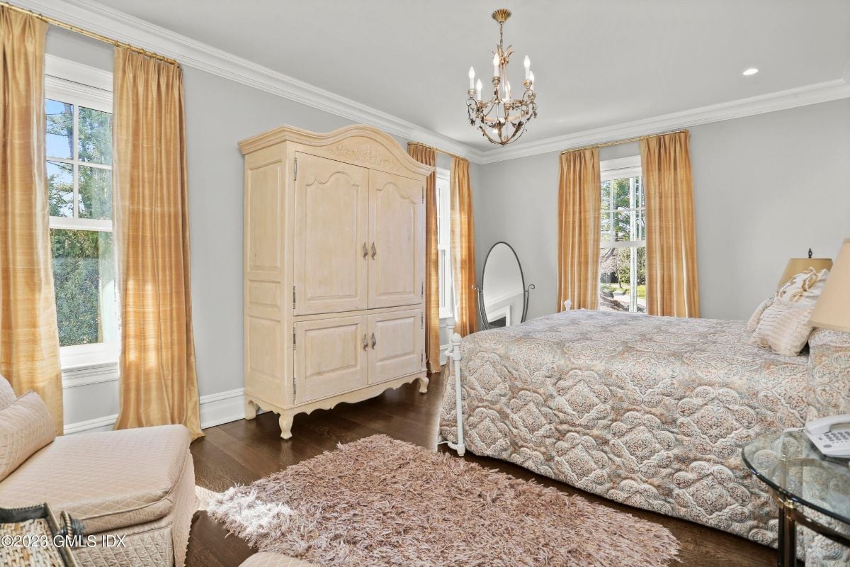 In the bedroom, the plush area rug added a touch of coziness to the space, complementing the sleek lines of the cabinet and creating a harmonious balance between comfort and style.