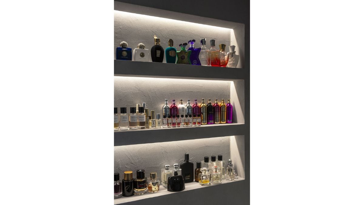 In this picture, we can see a cabinet filled with various scents.