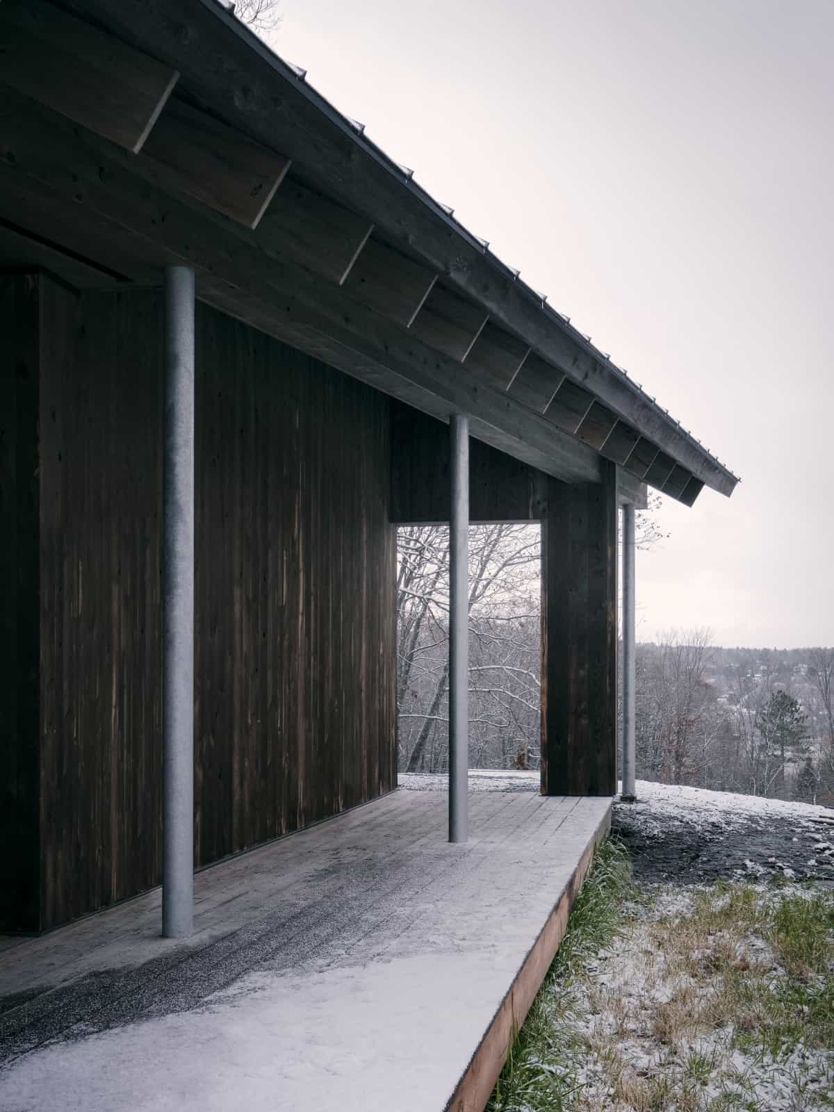 Steel tubular posts support the covered porch.