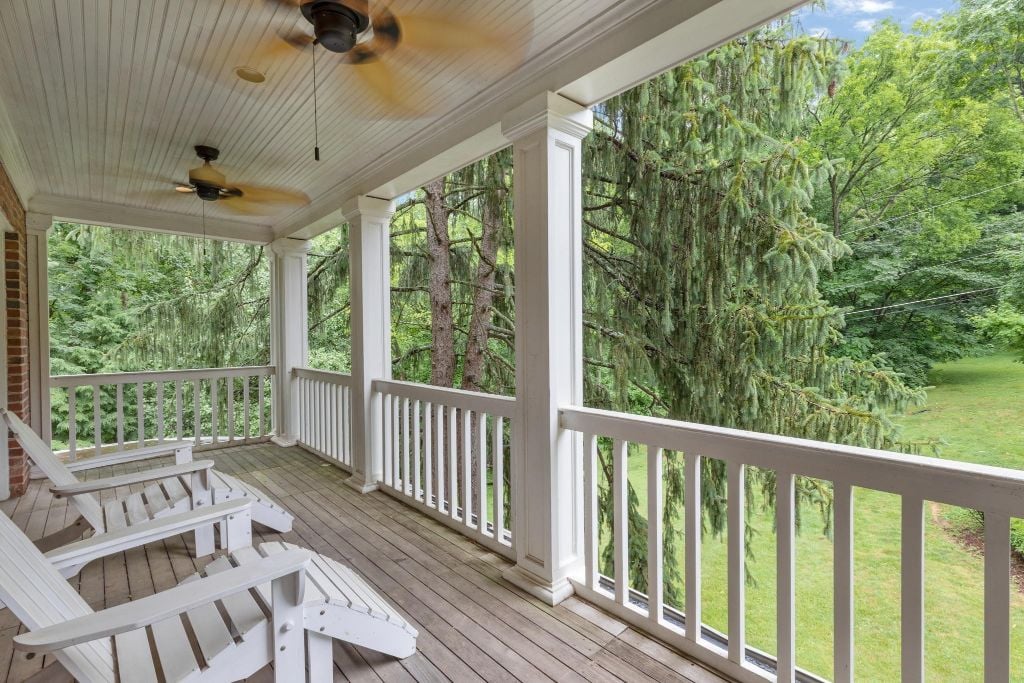 Covered balcony off the Primary bedroom faces eastward.