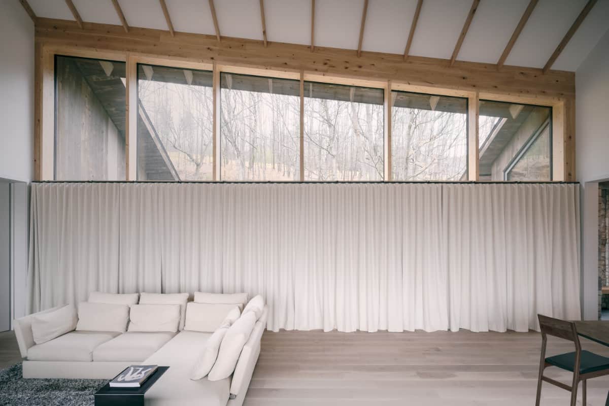 Taupe draperies can be spread out when looking for privacy.