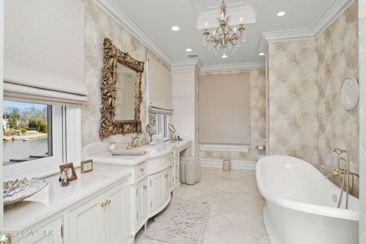The luxurious bathroom was a tranquil retreat, featuring a breathtaking freestanding bathtub that was perfect for a long, relaxing soak.