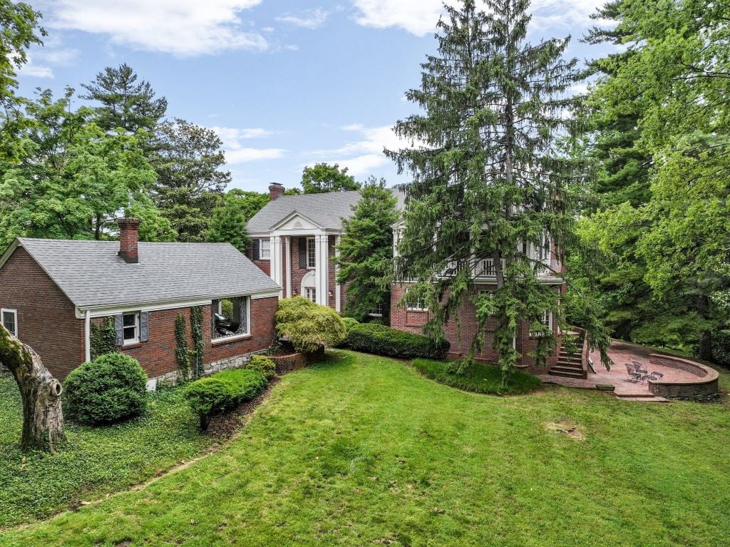 This is a house fit for all four season. The lush summertime scene is the backyard. There's room for a pool and poolhouse on this side.