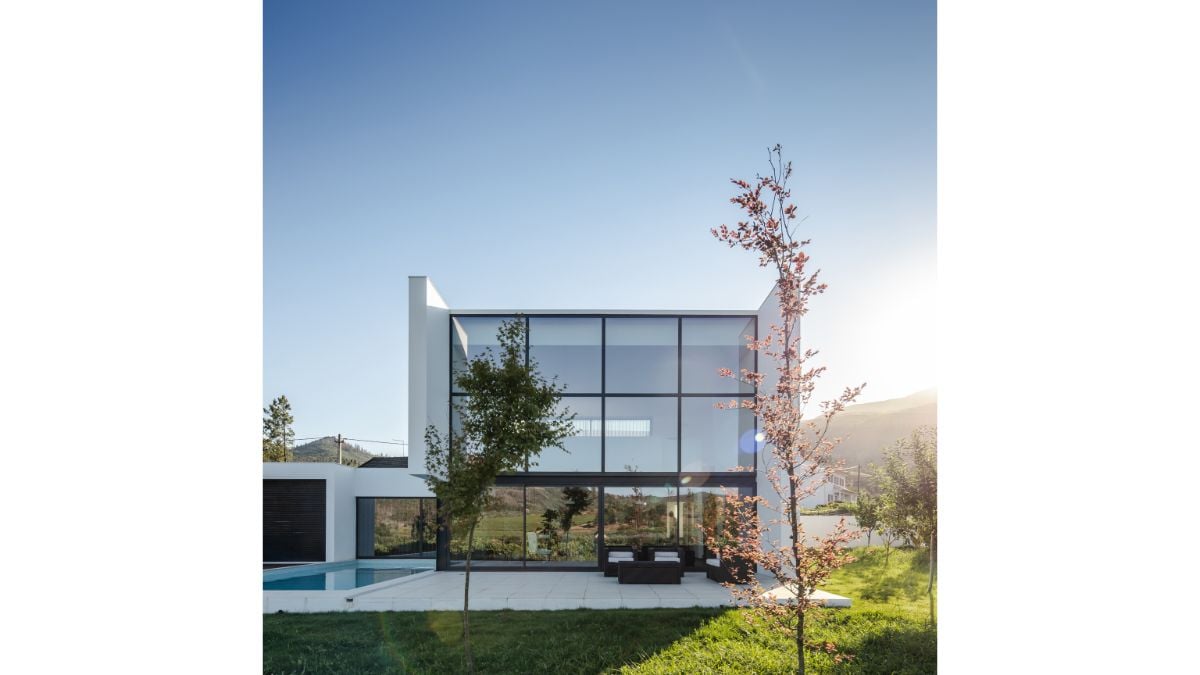 The spacious, high-ceilinged, expansive internal area that includes the isolated countryside contrasts with the exterior's formal economy.