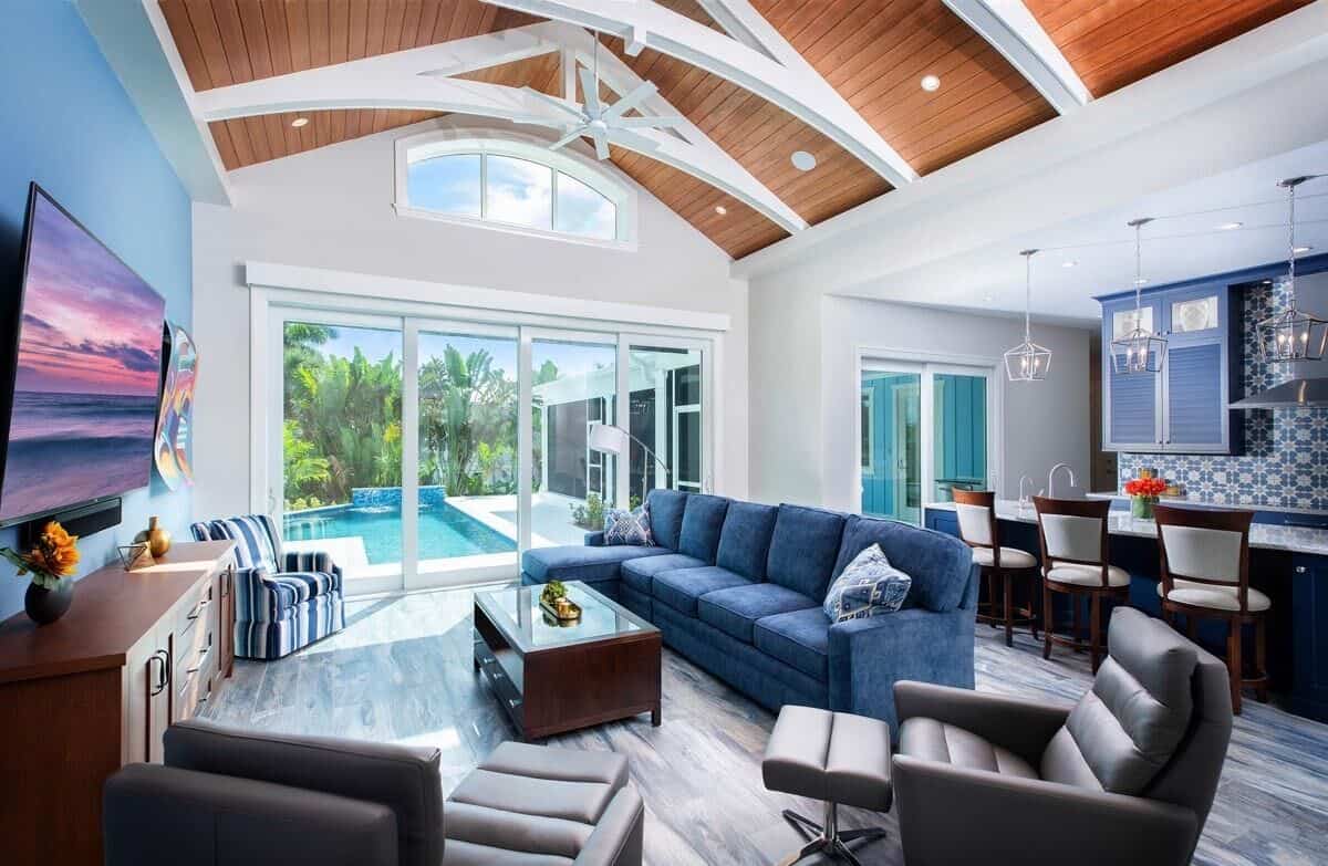 Sliding glass doors extend the living space onto the pool terrace.