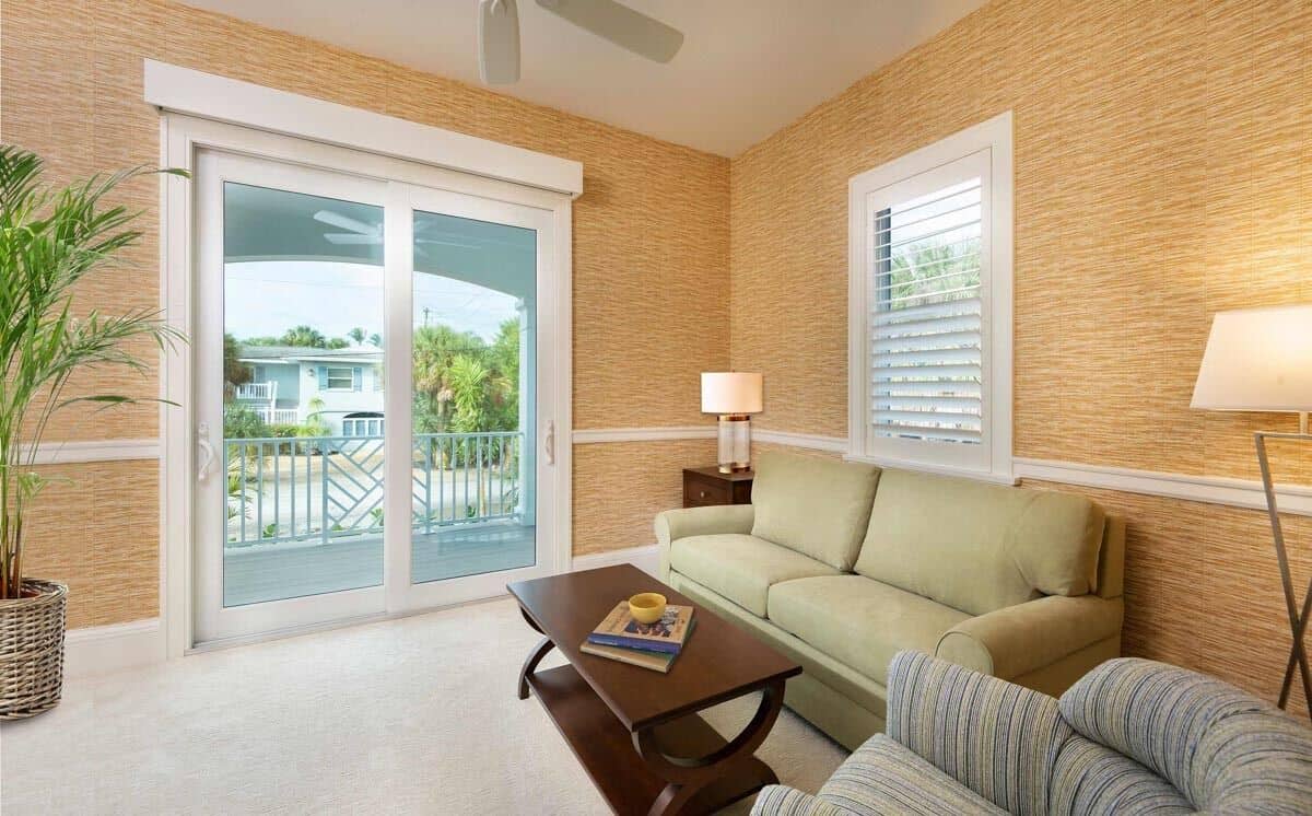 The den has also access to the front porch through sliding glass doors.