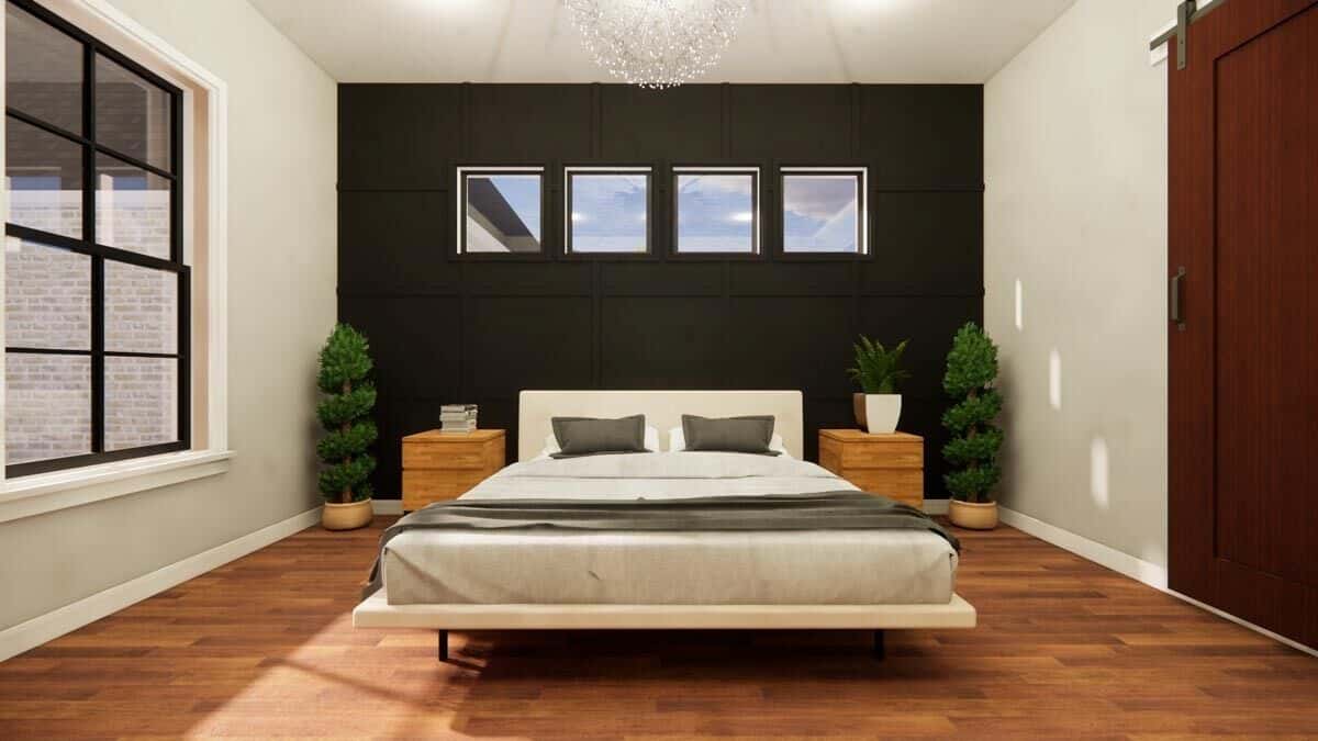 The primary bedroom has clerestory windows and a platform bed flanked by wooden nightstands.