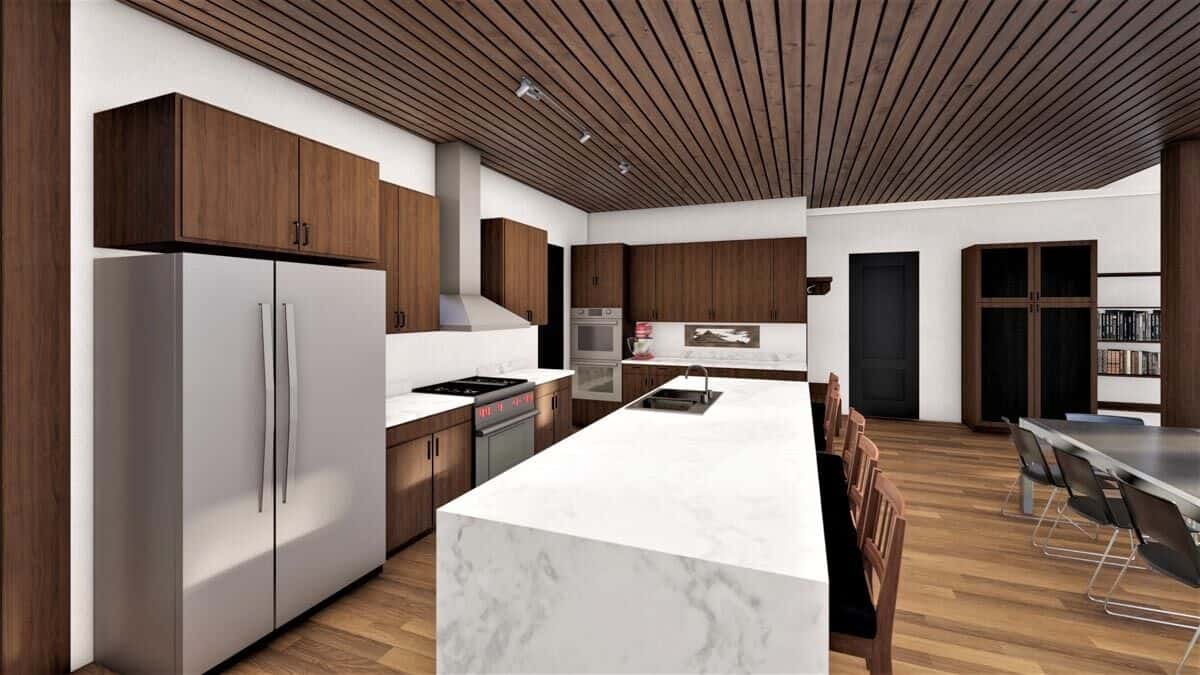 The kitchen offers stainless steel appliances, dark wood cabinetry, and a waterfall island fitted with double sinks.