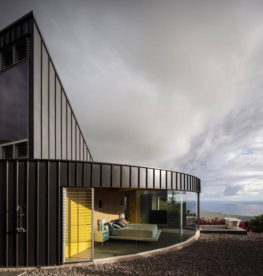 A steep roofed loft sits symmetrically at the back of the circle, like a classic 60โs D fin surfboard.