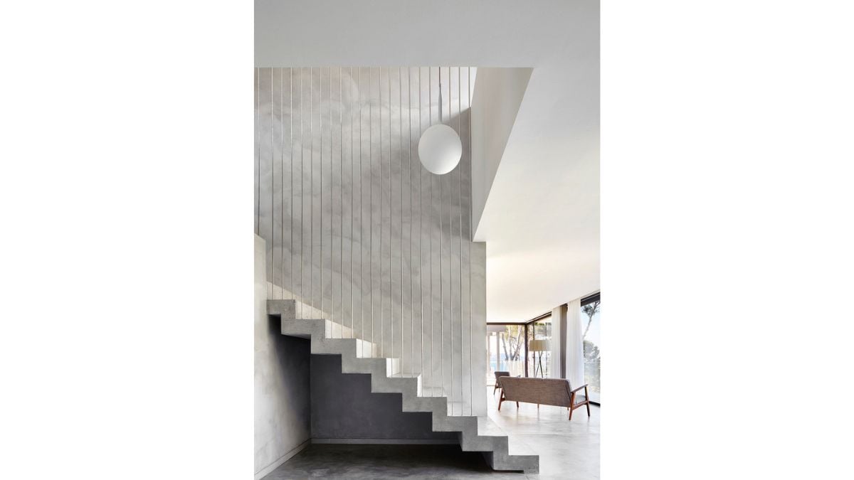 The interior of the house has a light grey color scheme that promotes relaxation and calm.