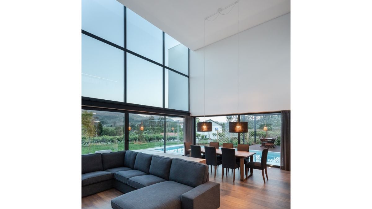 The space enlarges to a double-height volume following the compressed, conditional entry movement.