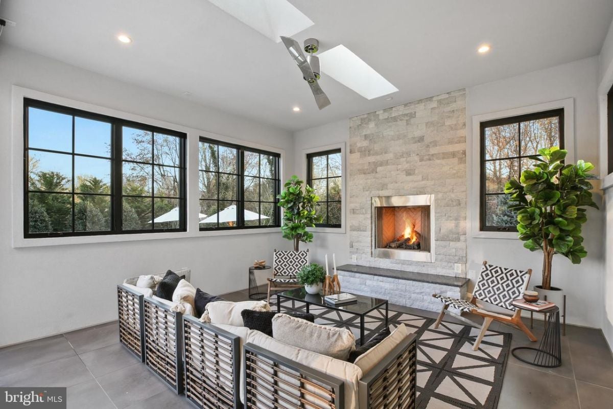 The intimate sitting room was enhanced by the warm glow of a crackling fireplace, creating the perfect ambiance for quiet relaxation and contemplation.