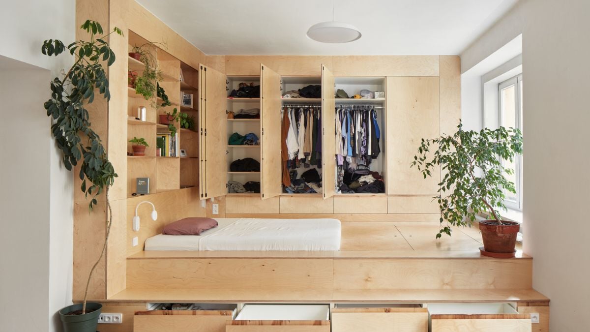 The materials chosen and their straightforward color palette emphasize the conversation between the apartment's living and service areas.