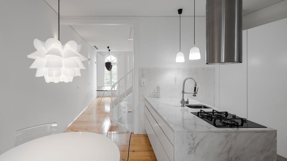 The kitchen and living room's boundaries were set by the stairway, resisting the natural urge for compartmentalization.