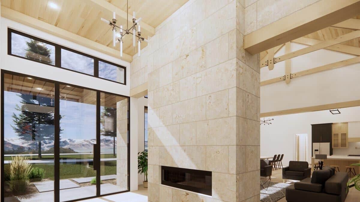 The double-sided fireplace is shared by the bright foyer.