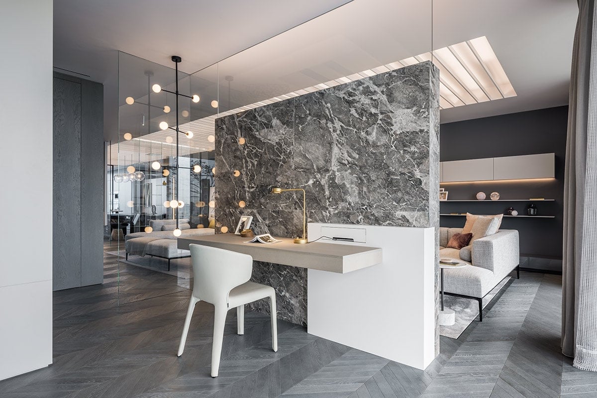The grainy Chinese marble divides the office and the living area.
