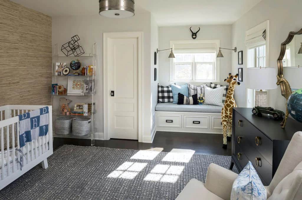 The second bedroom is also dedicated to a nursery with a dark hardwood floor and window seat nook.