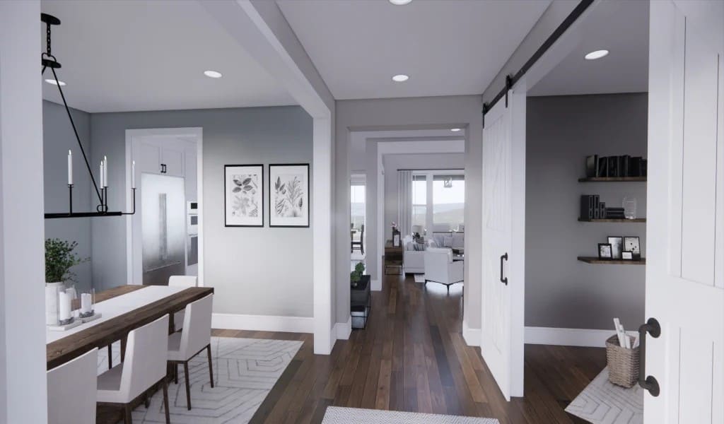 The foyer nestles between the formal dining room and study enclosed in sliding barn doors.