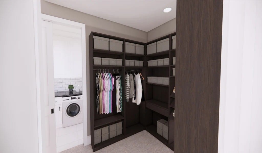 The walk-in closet offers lots of storage shelves and direct access to the laundry room.