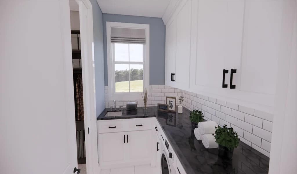 The laundry room is equipped with granite countertops, white cabinets, and a utility sink.