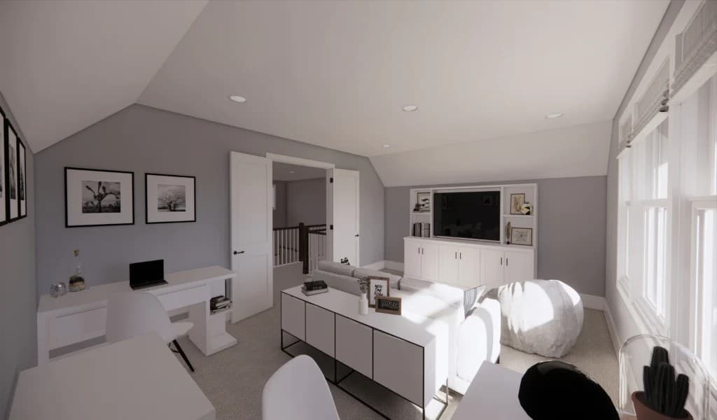 This room is filled with multiple desks, comfy seats, and a TV.