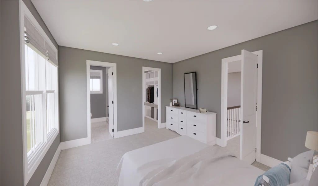 This bedroom offers a private bath and a walk-in closet.