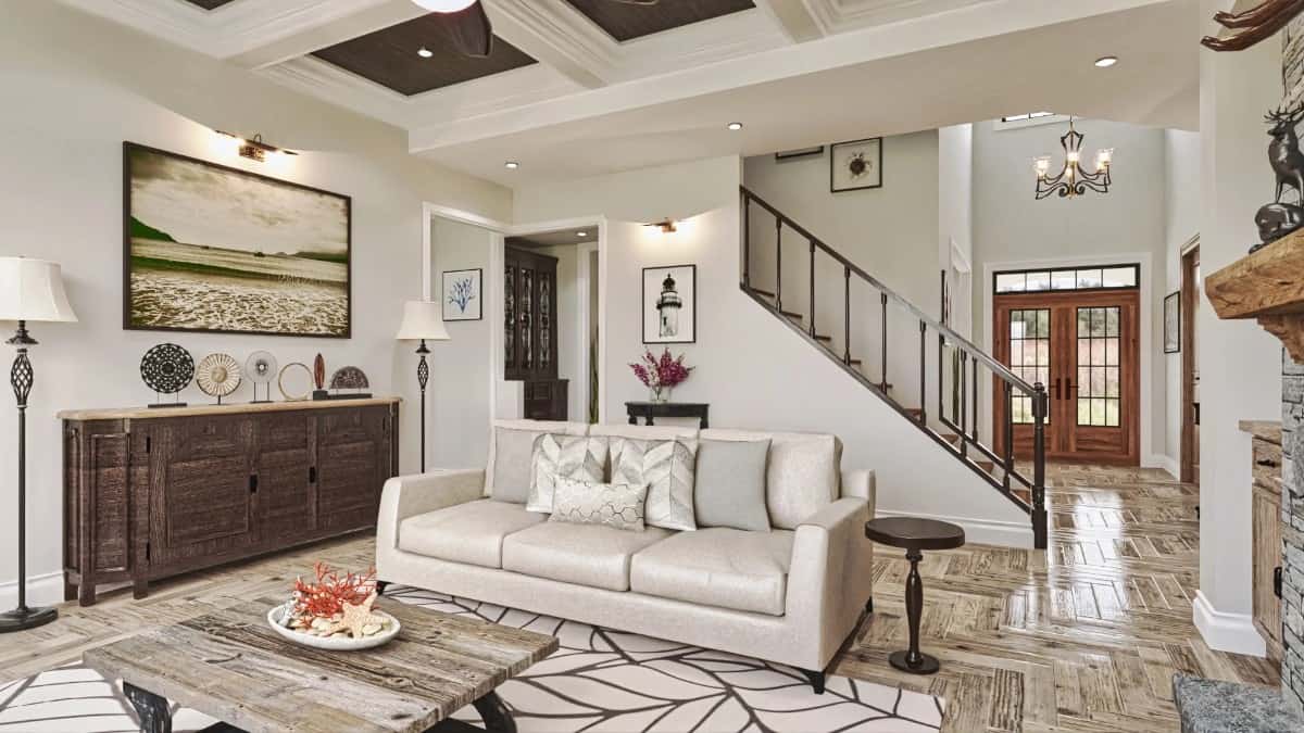 The foyer leads to the grand room crowned with a decorative coffered ceiling.