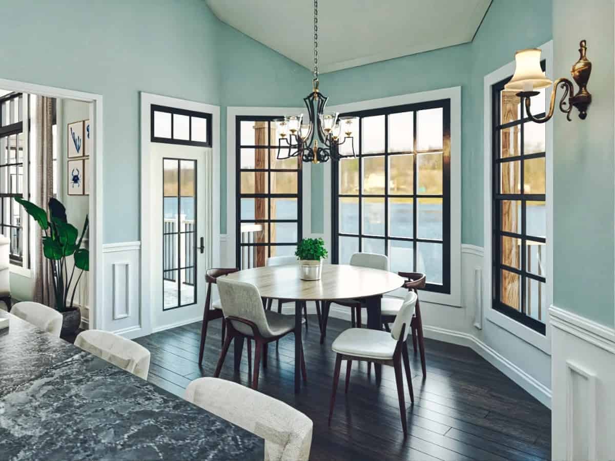 Breakfast nook with a round dining set, a bay window, and direct access to a covered porch.